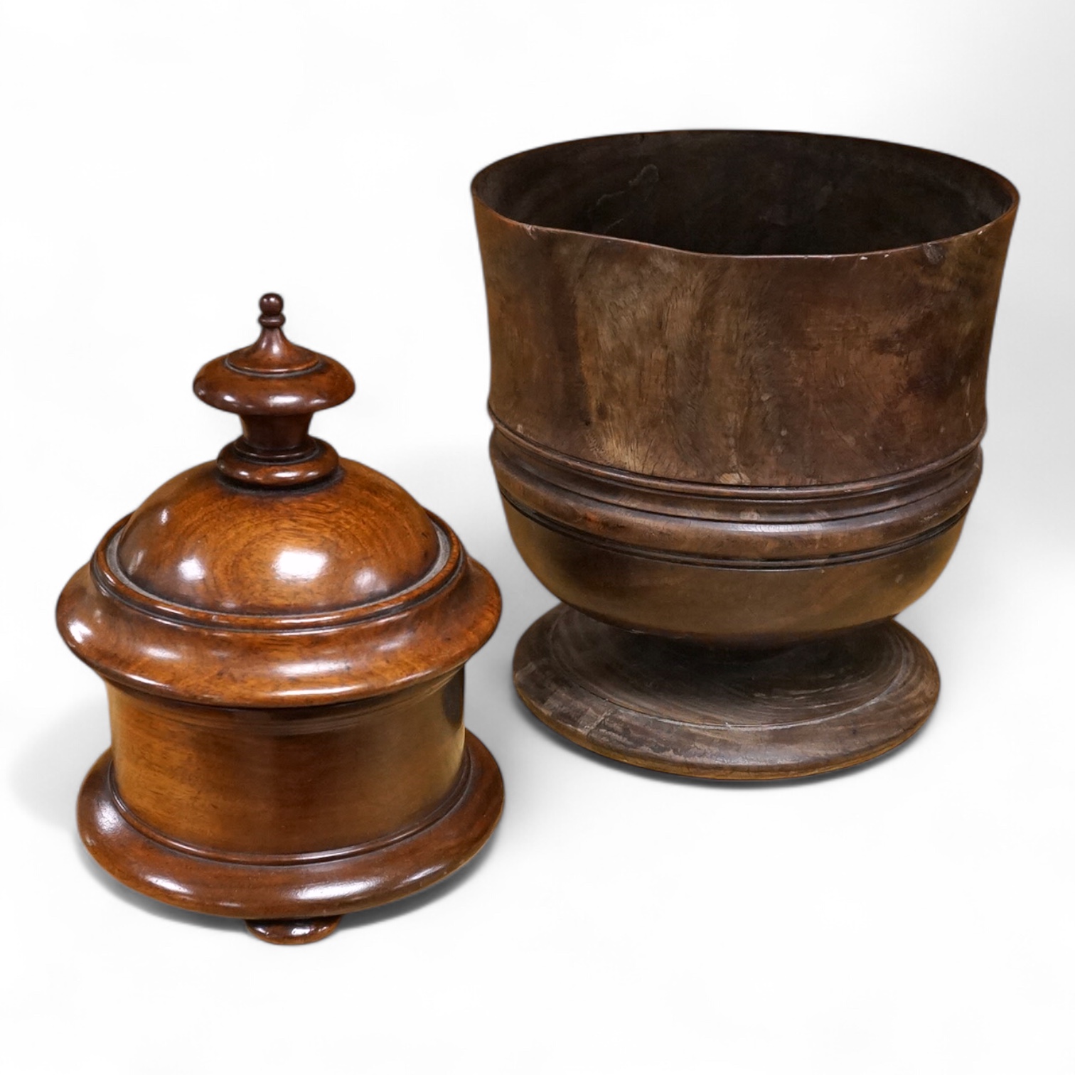 An 18th/19th century lignum vitae wassail bowl and a circular mahogany tobacco box, largest 18cm high